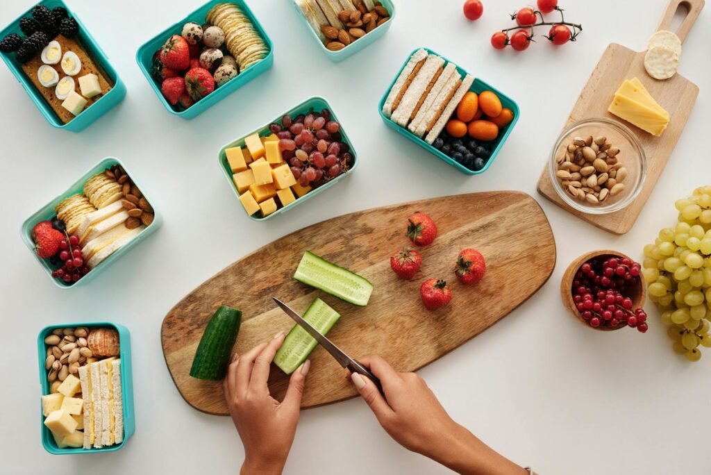 Meal-prep containers with turkey, vegetables, and avocado ready to portion