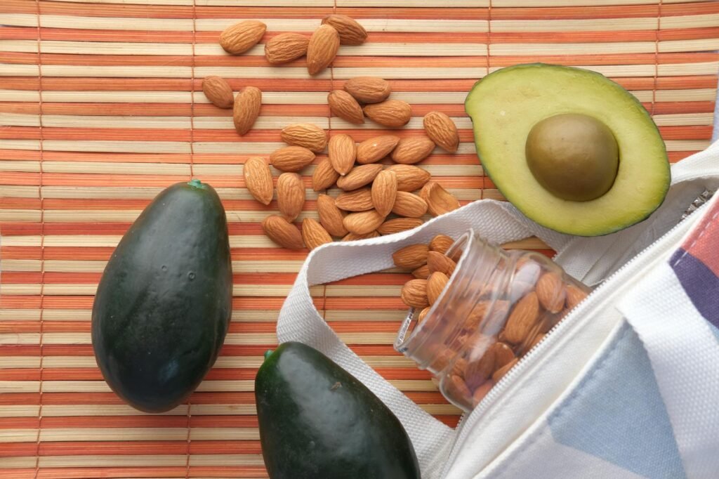 Avocados beside a grocery receipt and weekly meal planner