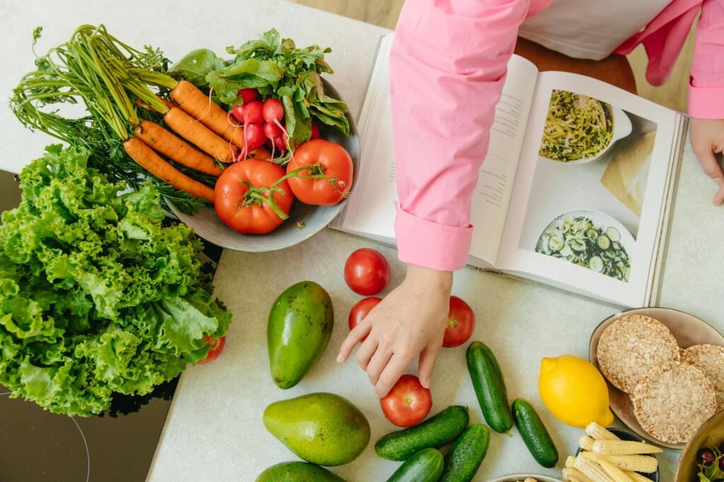 An overhead view of avocado salad ingredients arranged on a kitchen counter before tossing